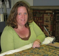 Camille Breeze, Founder and Director of Museum Textile Services completes conservation of an historic tapestry